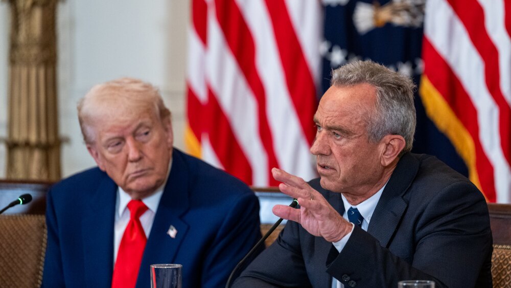 Health and Human Services Secretary Robert F. Kennedy Jr. speaks while President Donald Trump looks on