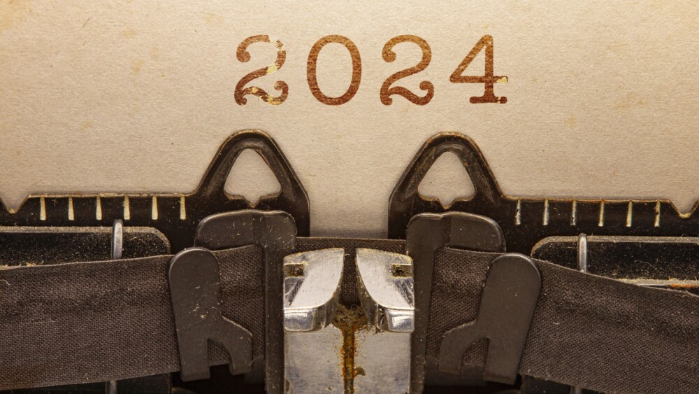 Year 2024 on a sheet of typewriter paper close-up