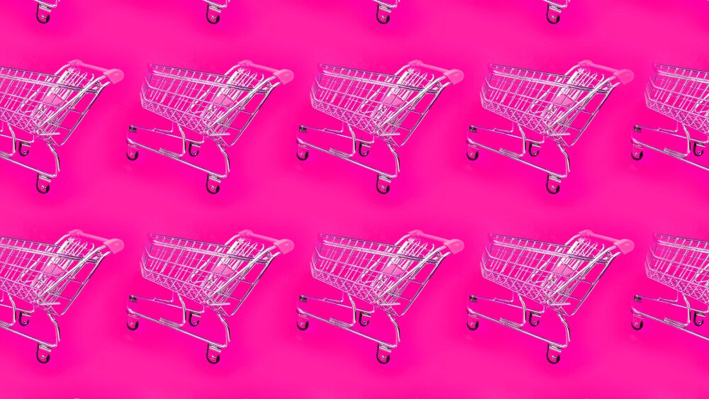 Bright pink background with a trolley for the supermarket. Modern web template for promotion design. Seamless geometric pattern. Abstract art.