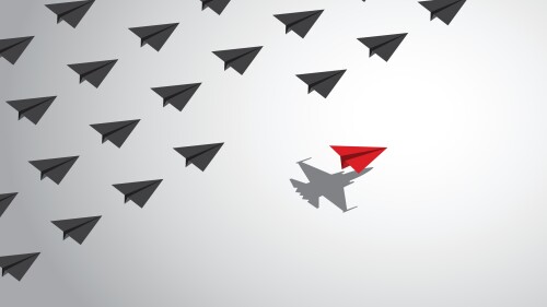 A red paper airplane with a fighter jet shadow changes course from a group of other paper airplanes, a concept of different business and social behaviors. Vector illustration.