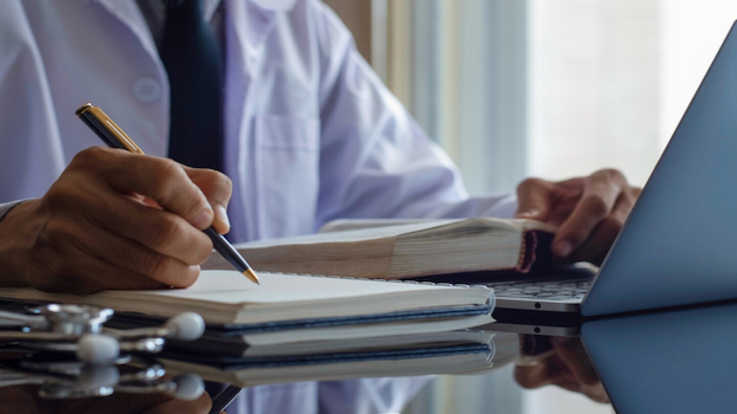 Pictured: Physician with notepad_iStock, Everyday