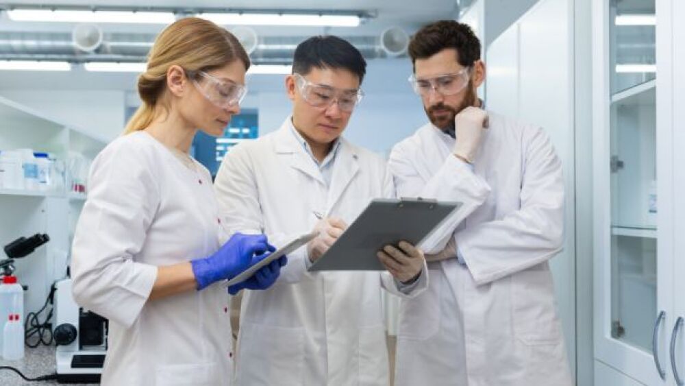 Pictured: Quality assurance professionals review findings in lab