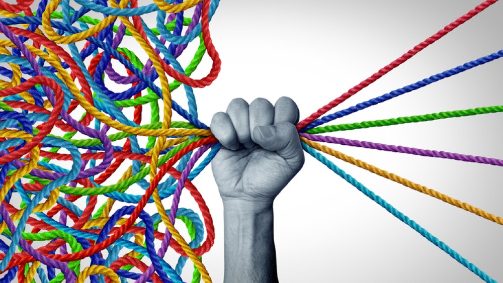 Organizing Solutions and organizer concept as a Management leadership taking charge as a leader sorting out diverse ropes into an organized patterns as a business concept for strategy and control.