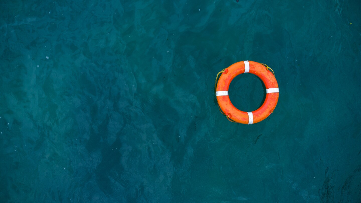 Image of life preserver floating in the sea