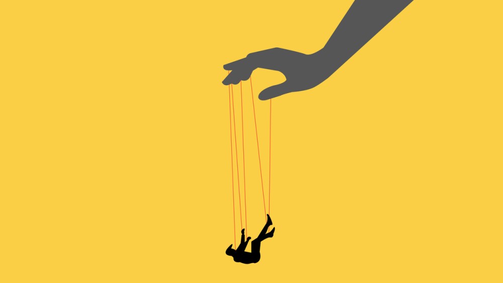 Illustration showing hand/puppeteer controlling falling businessman