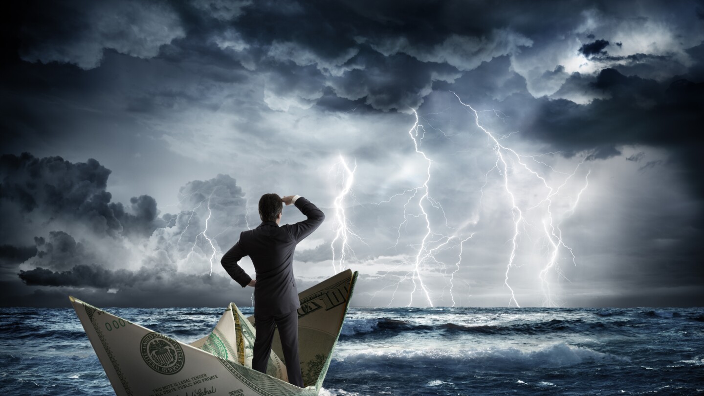 businessman on dollar boat with storm and lightning