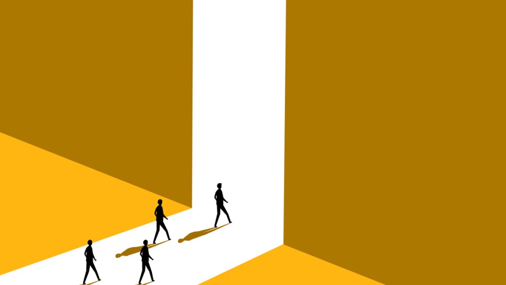 Employees walk toward exit