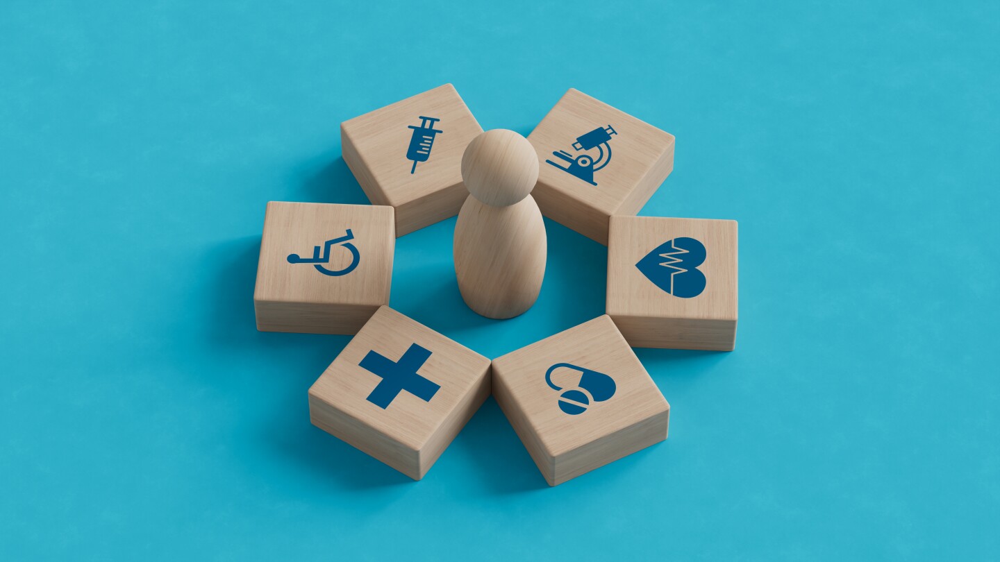 Wood block with healthcare medical icon on blue background. Health care insurance concept