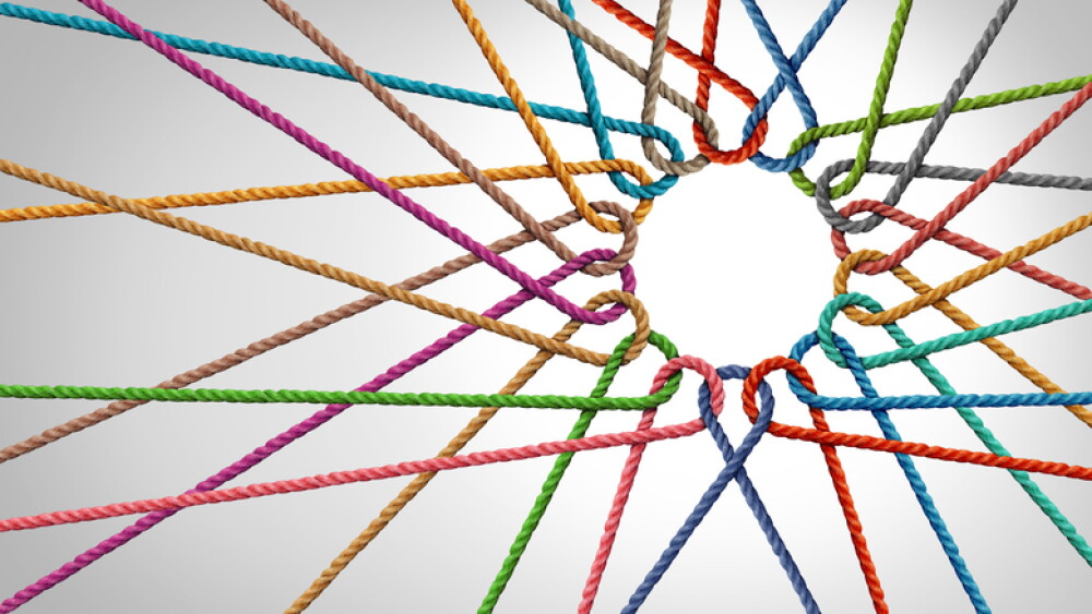 Business meeting concept as a group united together as a partnership symbol of strength.