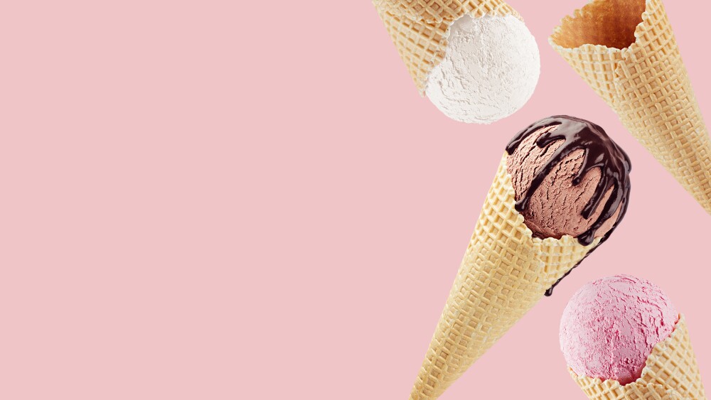 Decorative border of fly different flavor ice cream cones in waffle - white, pink, brown with chocolate sauce on pink.