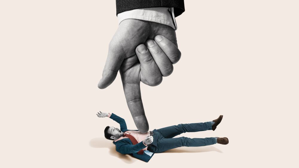 A finger presses down on a businessman. Art collage.