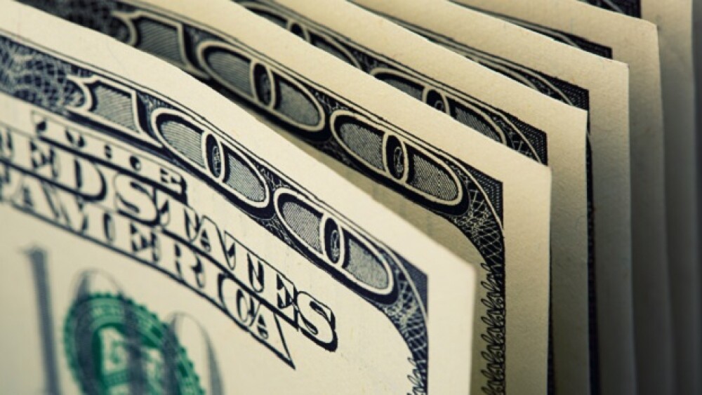Pictured: Close up of $100 bills/Nomad_Soul/Adobe