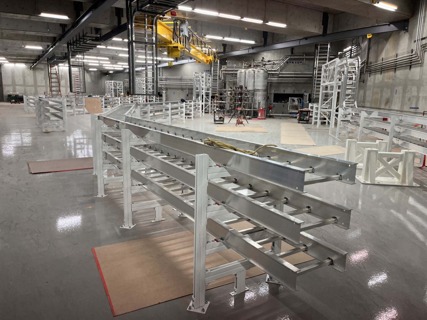 The linac Hall at Nusano's radioisotope production facility in Salt Lake City. Each track will route the beam into one of 12 windows to meet a target, creating the isotopes.