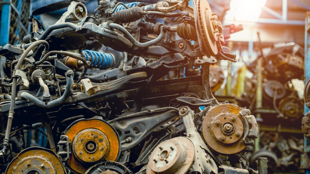 stock pile of used auto parts store for sale recycle, car old wheel hub spare part from scrapyard