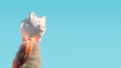 Piggy bank rocket launcher with smoke trail on blue background. Savings growth concept. 3D Rendering, 3D Illustration