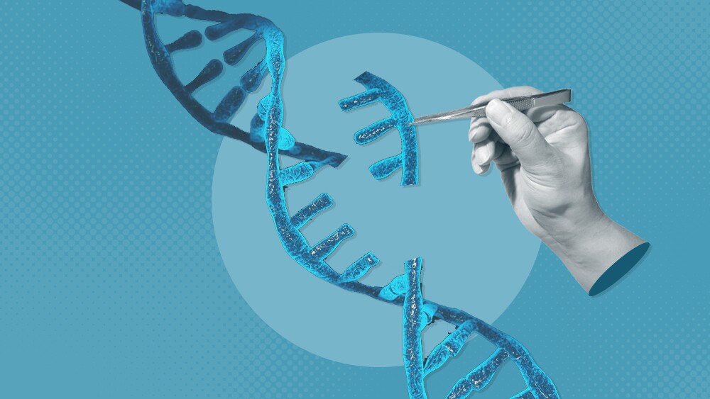 A hand cutting a slice of DNA