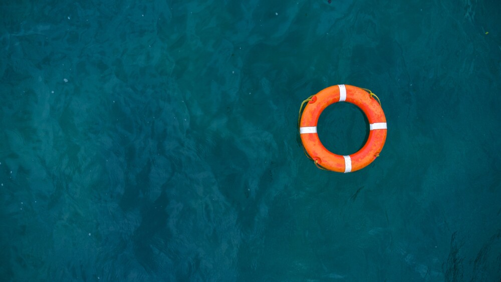 Image of life preserver floating in the sea
