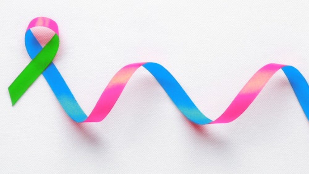 Pictured: A green, blue and pink ribbon representi