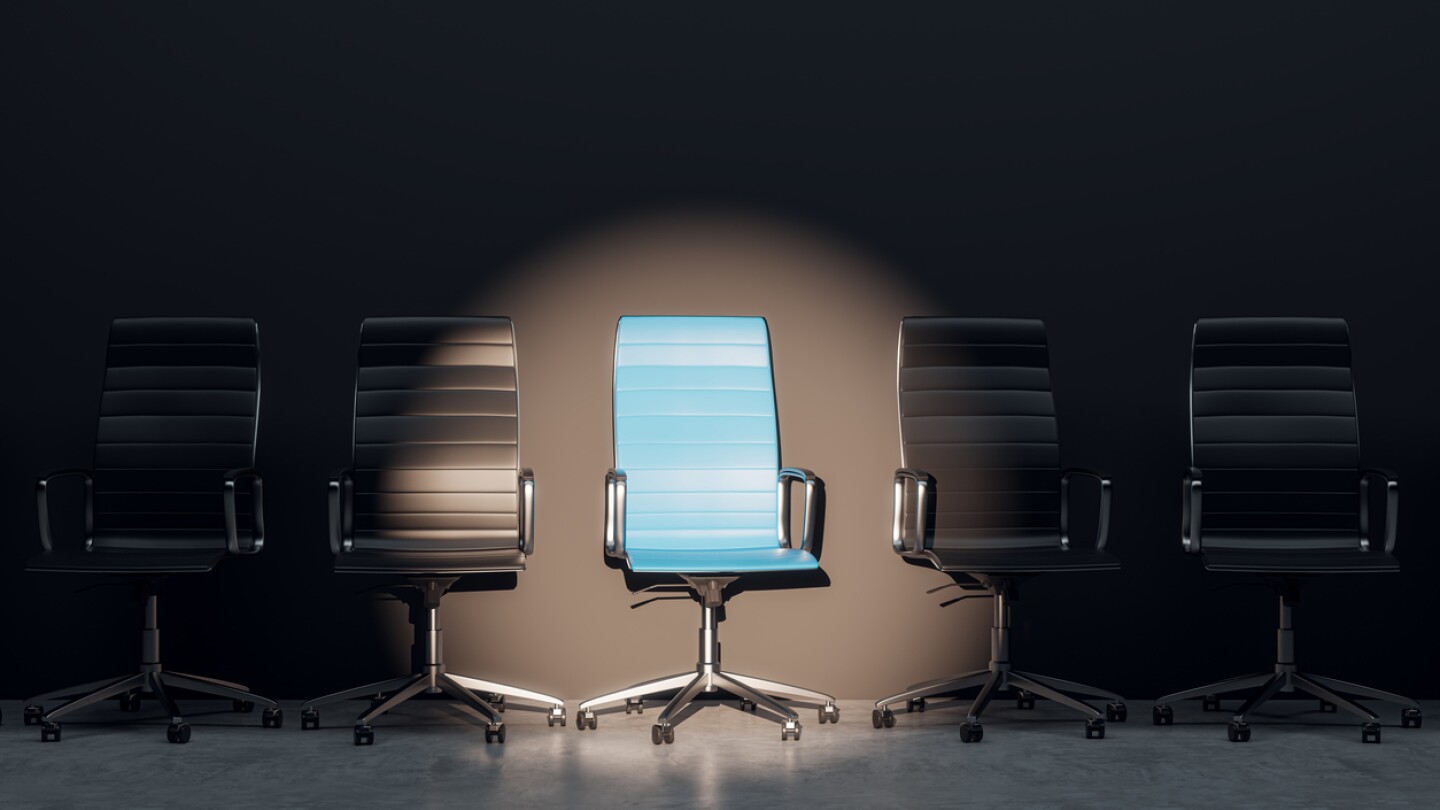 Job interview, recruitment concepts. Row of chairs with one odd one out. Job opportunity. Blue chair in spotlight. Business leadership. 3D Rendering