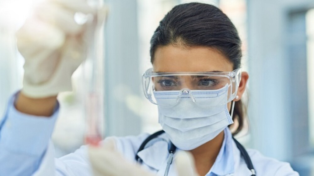 Shot of a young scientist working in a lab