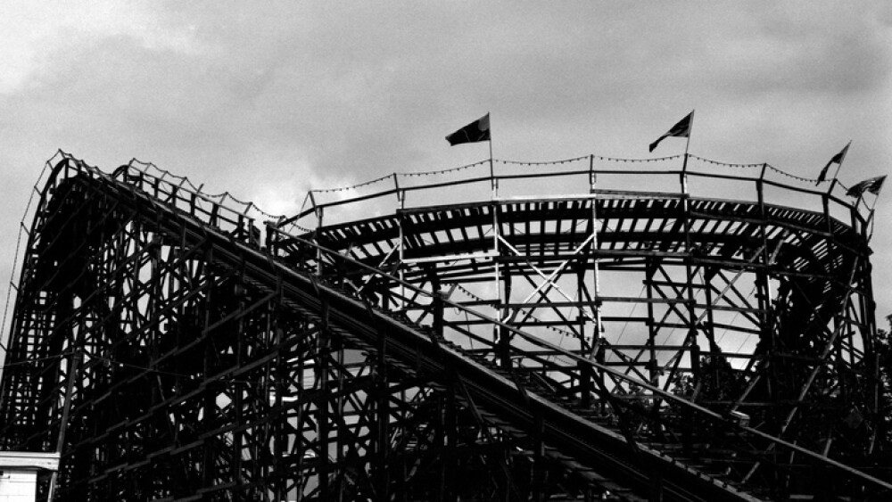 A silhouetted roller coaster, taken on high speed black and white film for dramatic effect.