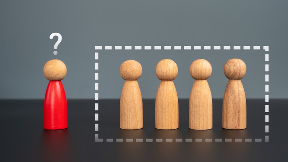 There is no place for the red man in the group. Social isolation. Exclusion, discrimination.