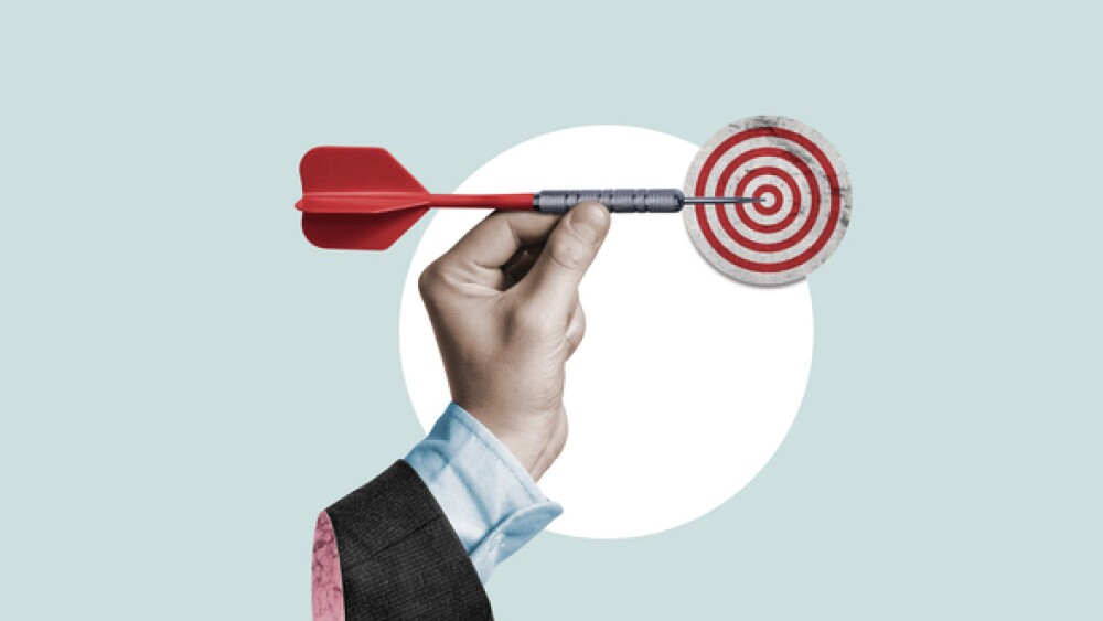 Businessman holding a dart aiming at the target - business targeting, aiming, focus concept. Art collage.