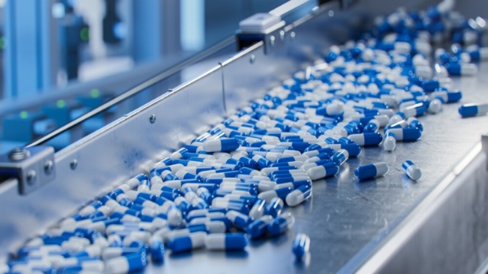 Pictured: Capsules in a production line at a pharm