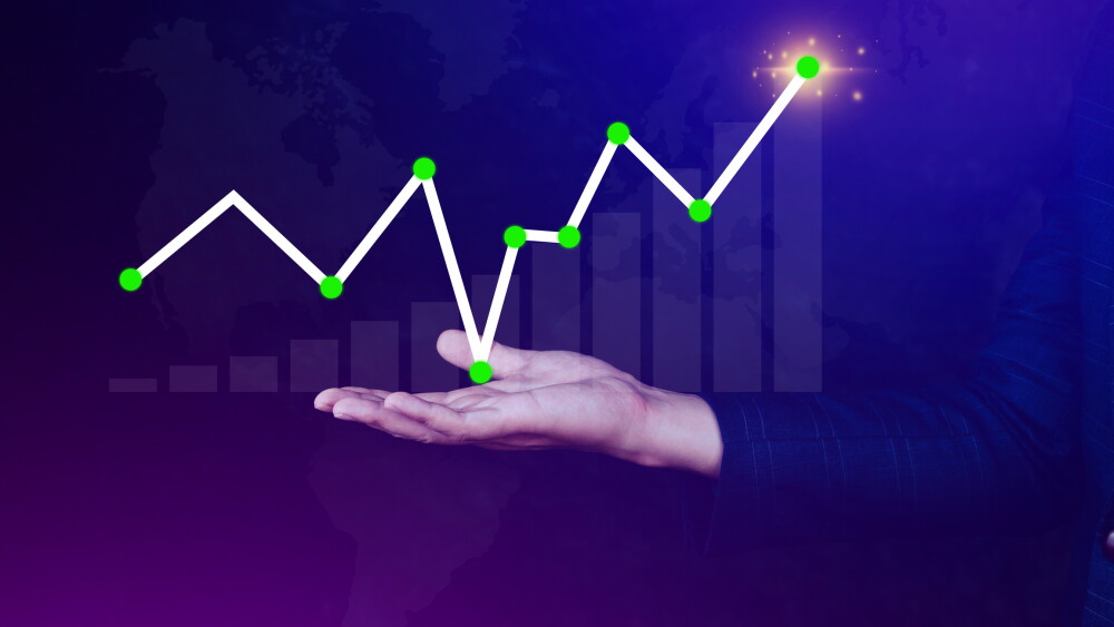 Businessman drawing growth curve, growth forecast chart, bussiness success concept. Hand drawing a graph representing increasing profits.