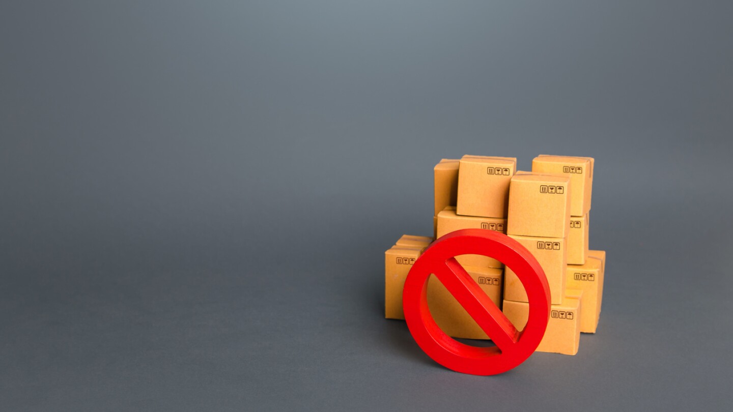 Boxes and prohibition symbol NO. Trade wars. A ban on the import of goods. Impossibility of transportation, oversupply. Shortage of goods. Sanctions and embargoes. Confiscation of contraband.