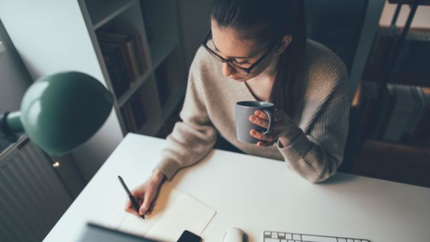 Pictured: Manager working from home at her desk