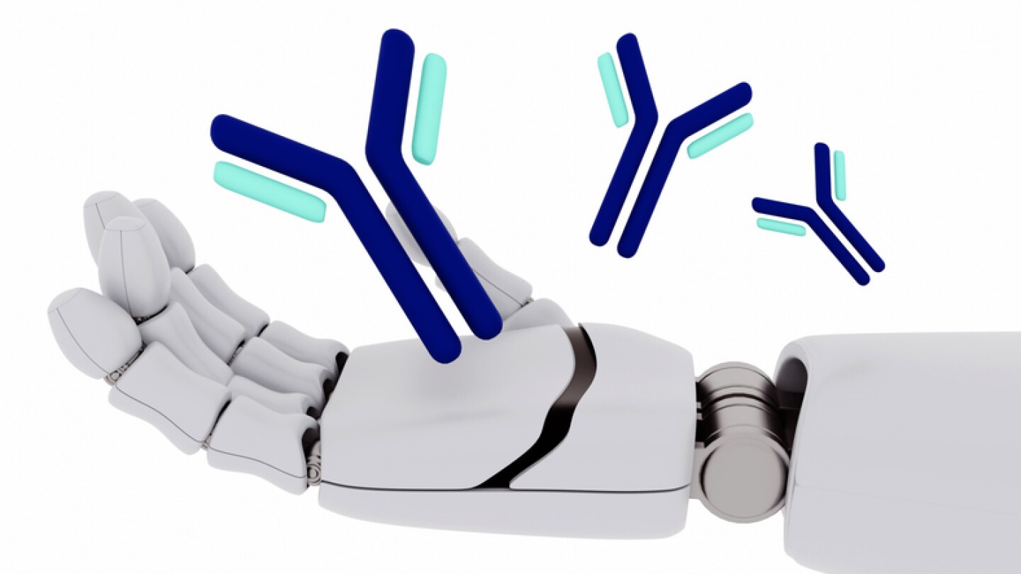 A 3D rendering depicts an antibody molecule floating above robotic hands against a white backdrop.