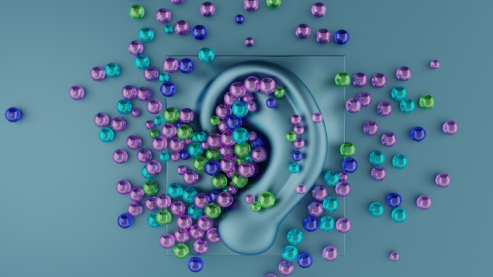 Multicolored orbeez balls scattered on a ASMR microphone. Autonomous Sensory Meridian Response. Relaxing sound concept. 3d illustration