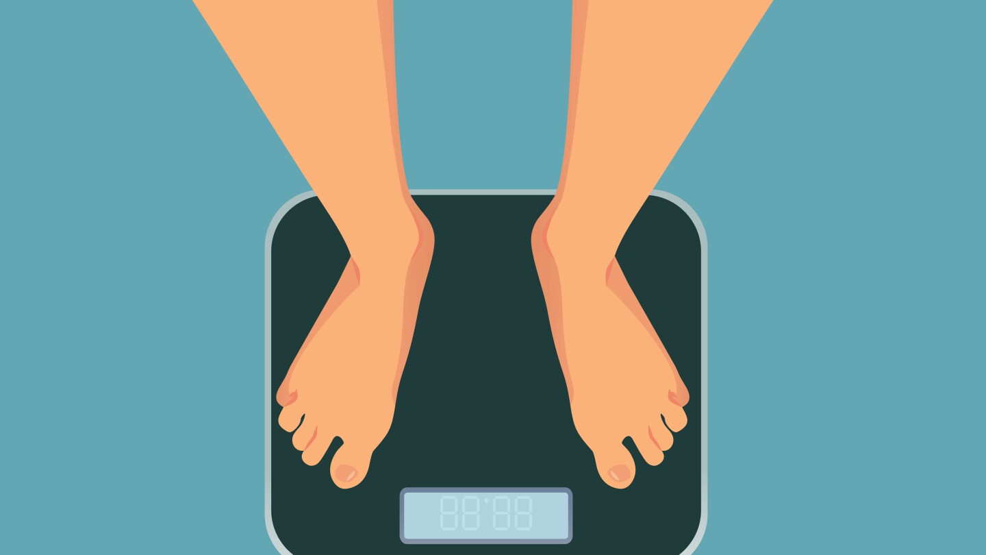 Woman checking her weight on a measuring device after dieting