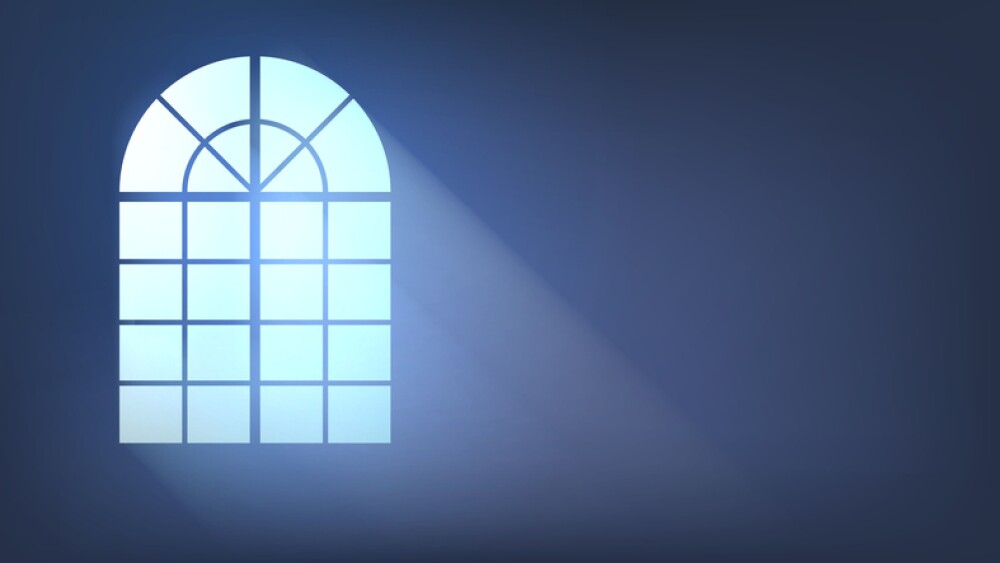 Window in a dark room with rays of light, home interior with one window