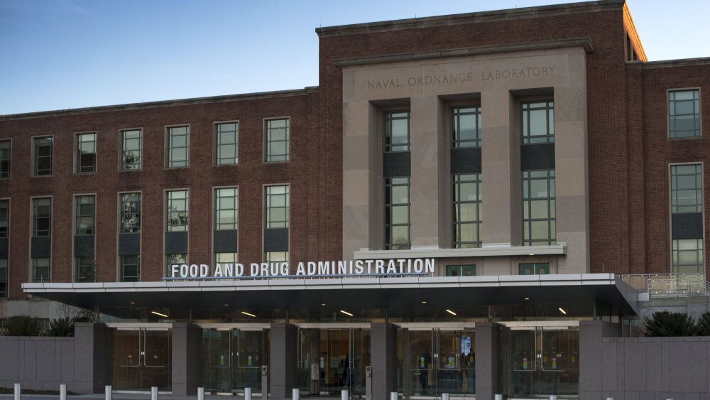 The entrance to a brick building with the words Food and Drug Administration across the top