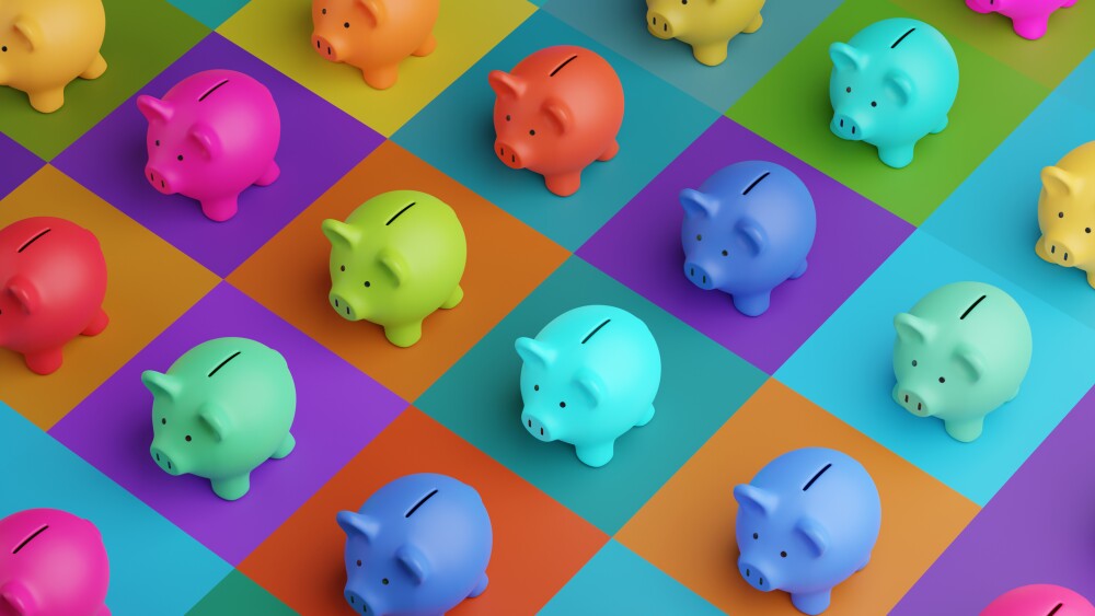 Array of piggy banks in saturated colours on high colour contrast background. Illustration of the concept of bank savings, financial investment and multiple sources of income