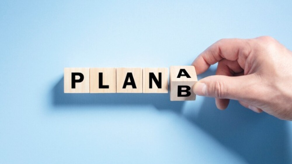 Pictured: Hand changing blocks from Plan A to B/iS