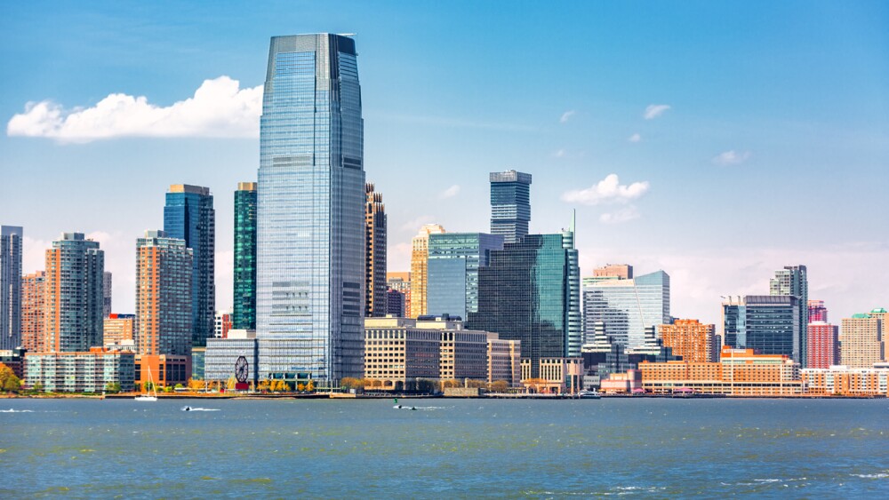 Photo of Jersey City skyline viewed from a boat sailing the Upper Bay