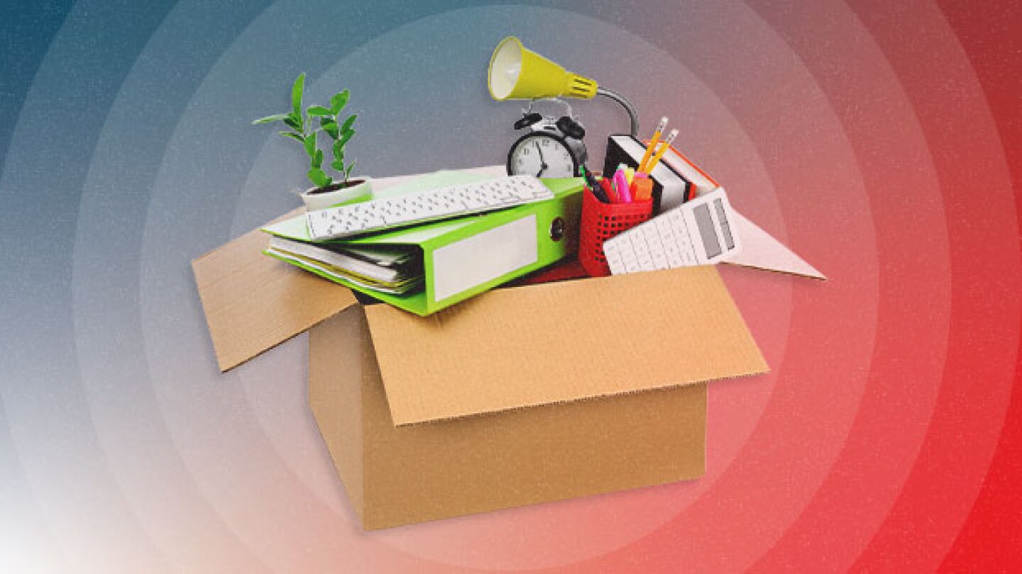 Illustration of cardboard box filled with office supplies, a computer keyboard, lamp, and a potted plant