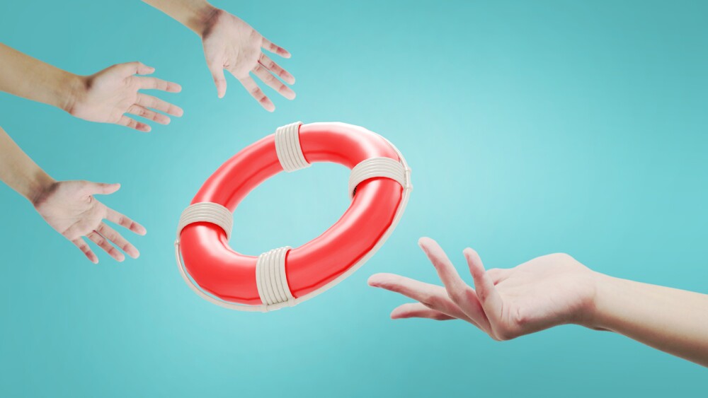 Lifebuoy for help and Support to survive Concept. Hands of a businessman who receives and Digital Graphic design on Blue background. copy space- 3d rendering