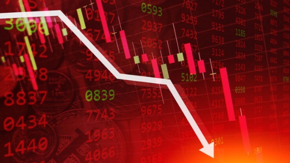 Pictured: Downward arrow in graph showing stock price dropping