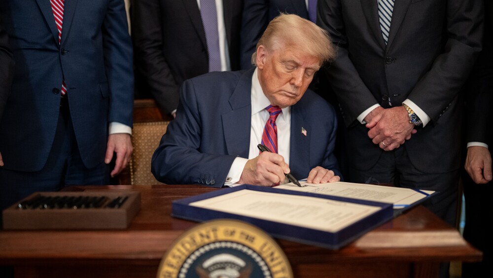 President Donald Trump signs S.1852, The GENIUS Act, Friday, July 18, 2025, in the East Room of the White House. (Official White House Photo by Daniel Torok)